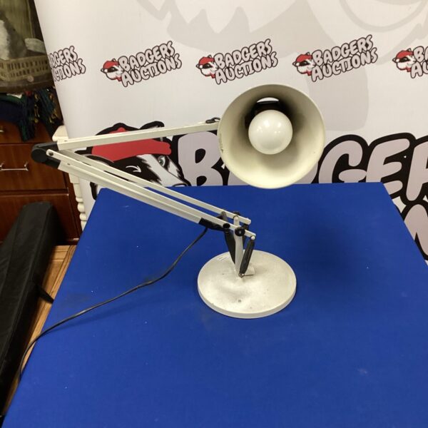 Vintage Anglepoise Model 90 lamp with adjustable shade and classic design.