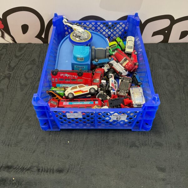 Crate of mixed diecast vehicles including Matchbox and Hot Wheels.