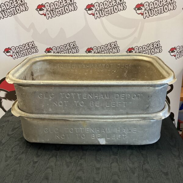 Large galvanised metal trays for garden or workshop use.