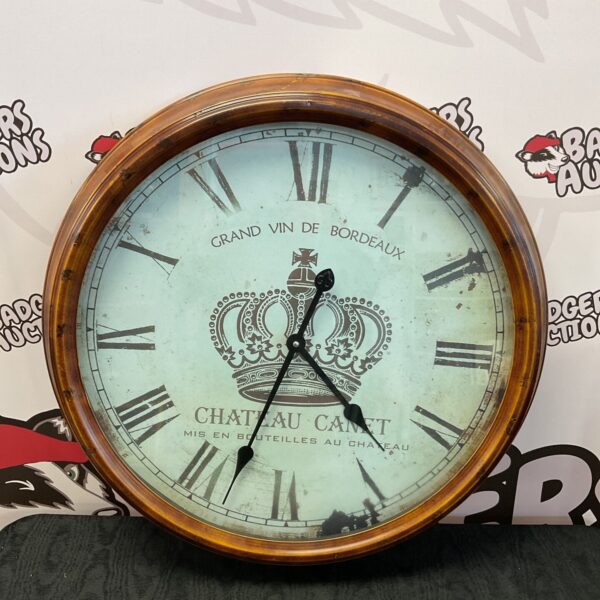 Vintage Grand Vin de Bordeaux wall clock with detailed face.
