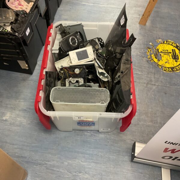 Overview of a large lot of gaming console parts and accessories.