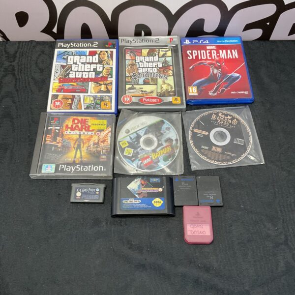 Video game lot featuring PlayStation 2, Xbox 360, and Sega Genesis games.