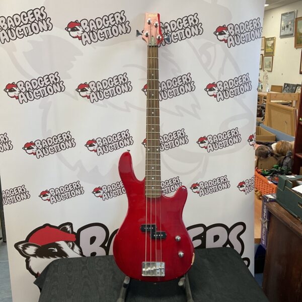 Red Ashton bass guitar, four string electric instrument.