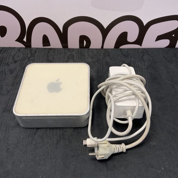 Vintage Apple Mac Mini A1347 computer with power supply.