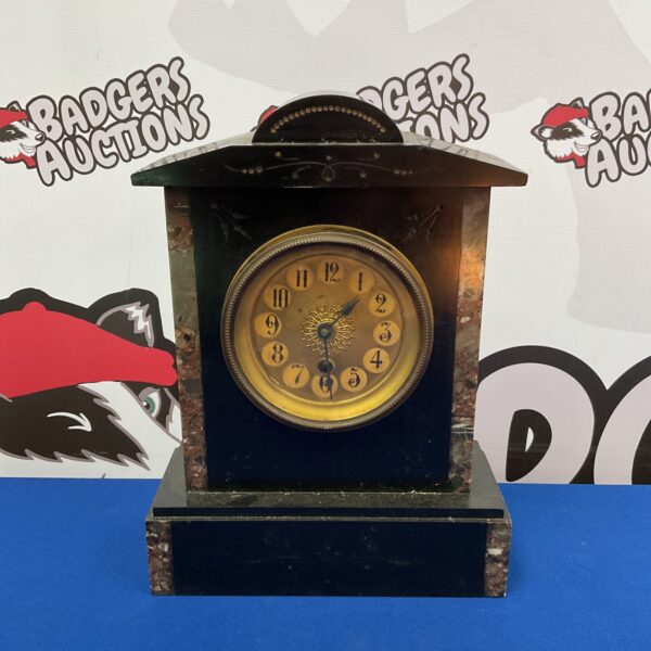 Antique 19th century slate mantle clock with marble details.