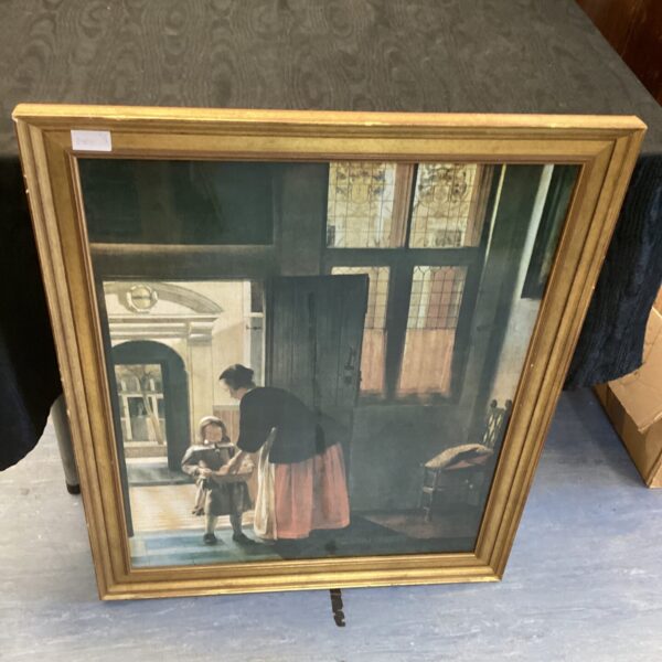Framed Pieter de Hooch print depicting a boy bringing bread.