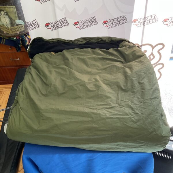 Large Trakker carp fishing sleeping bag, ideal for overnight angling.