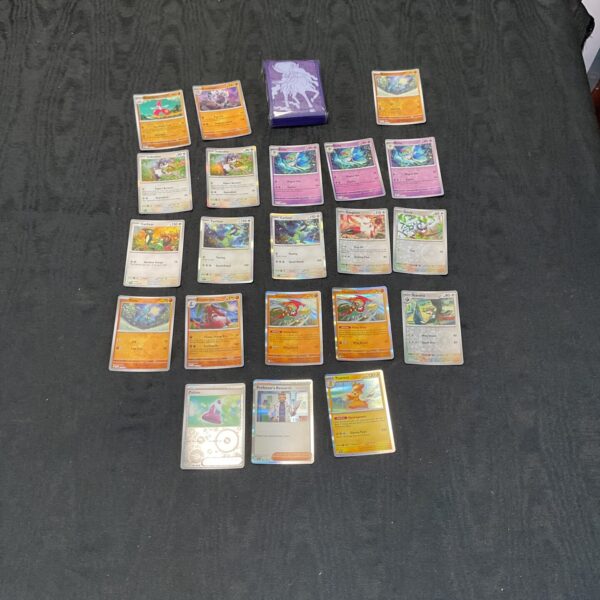 Selection of Pokemon holo cards with protective sleeves for collectors.