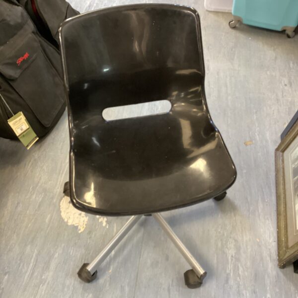 Black vintage office swivel chair with plastic seat.