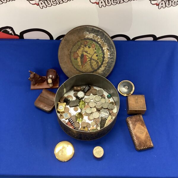Vintage tin filled with a mixed lot of old collectible coins.