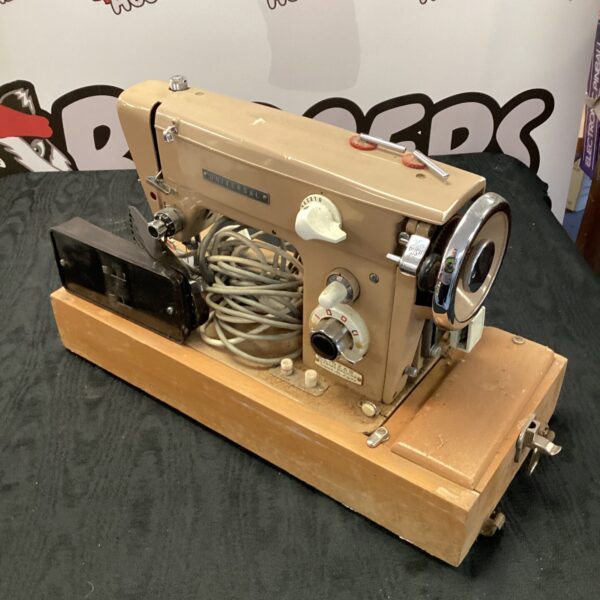 Vintage Universal zigzag sewing machine, side view.
