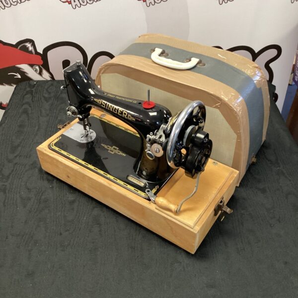 Vintage Singer sewing machine in its original carrying case.