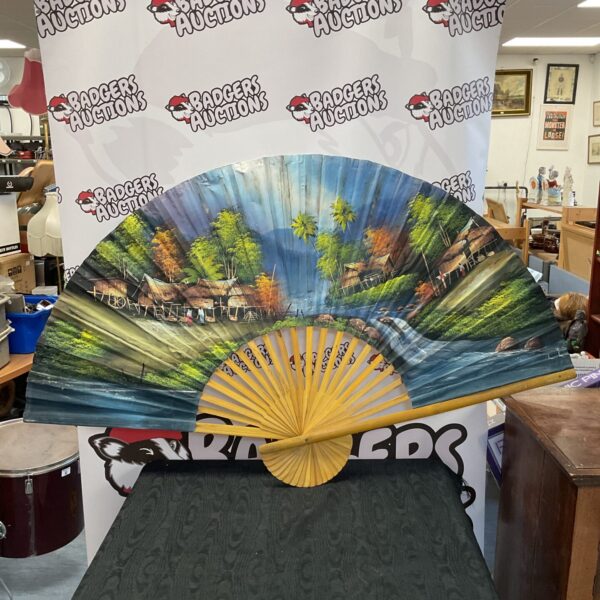 Large vintage oriental fan with detailed hand painting.
