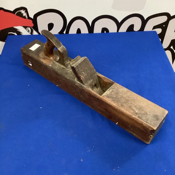 Large vintage wood plane, antique carpentry tool for smoothing wood.