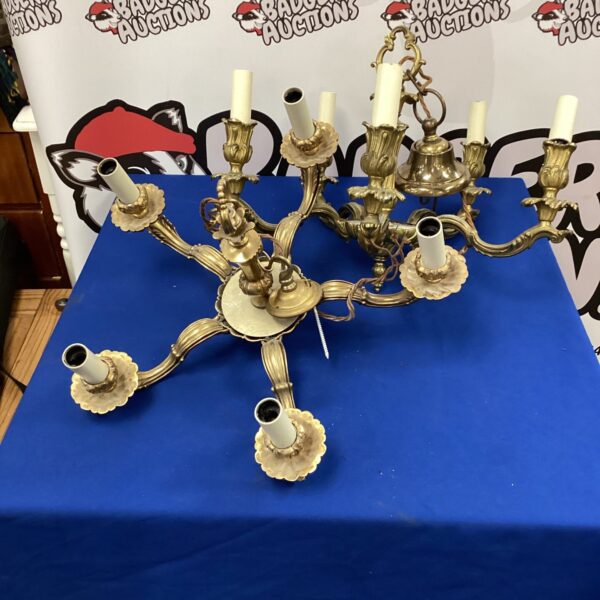 Vintage brass ceiling chandeliers with multiple arms and light sockets.