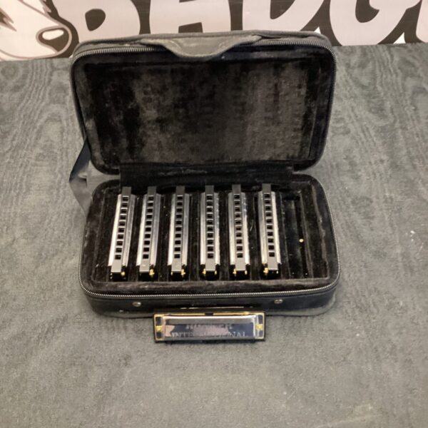 Vintage Hohner Blues Band harmonica in its case.