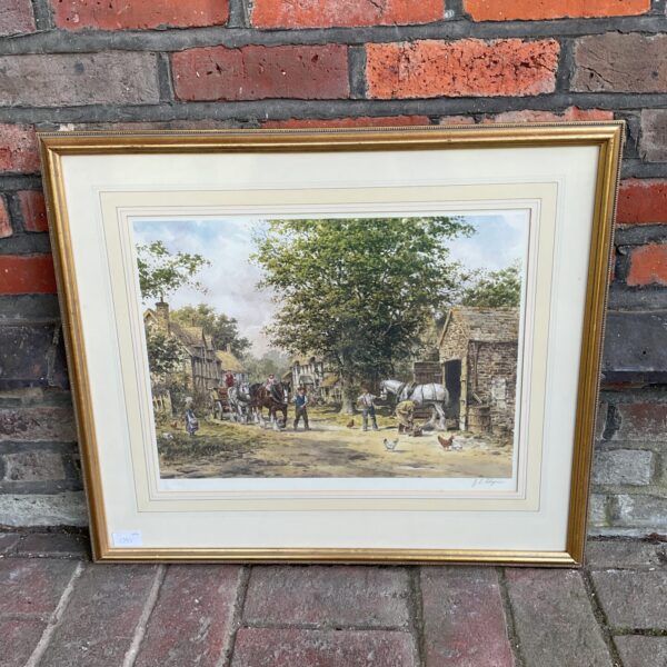 Signed John L Chapman print depicting a village blacksmith scene.