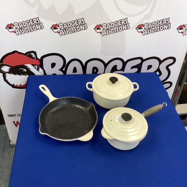 Lot of three Le Creuset cast iron pans with enamel coating.