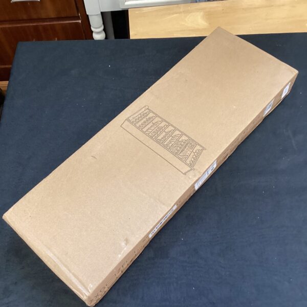 New metal wire shoe rack still sealed in its box.