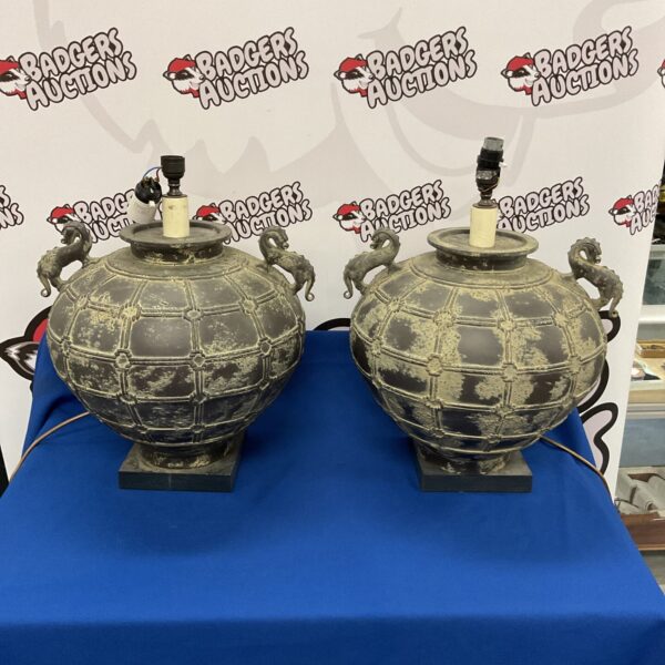 Pair of vintage Chinese dragon table lamps with intricate metalwork.