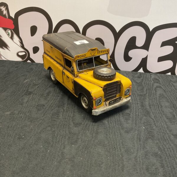 Vintage AA recovery truck, yellow tinplate vehicle, collectible toy.
