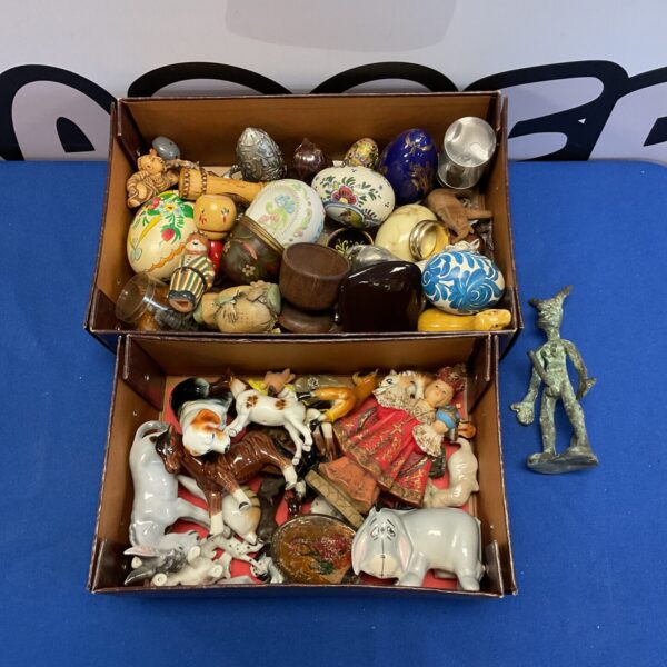 Vintage collection of animal ornaments and decorative eggs.