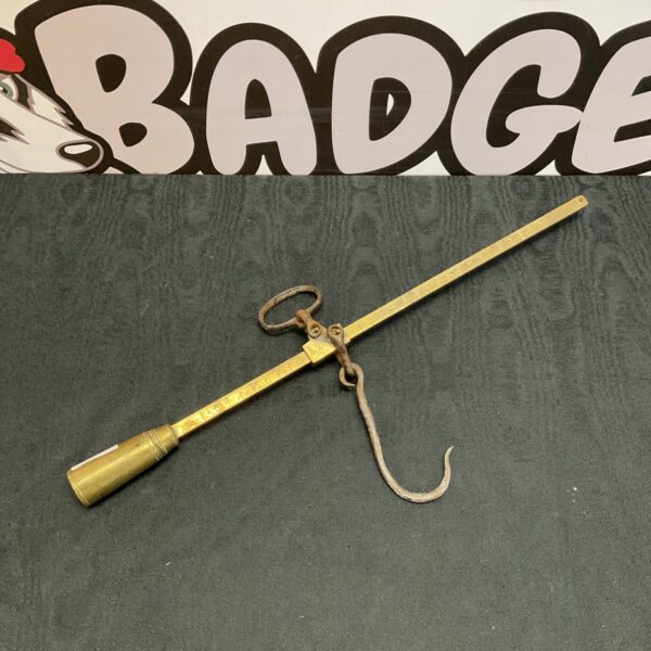 Antique brass beam scales with a hanging pan.
