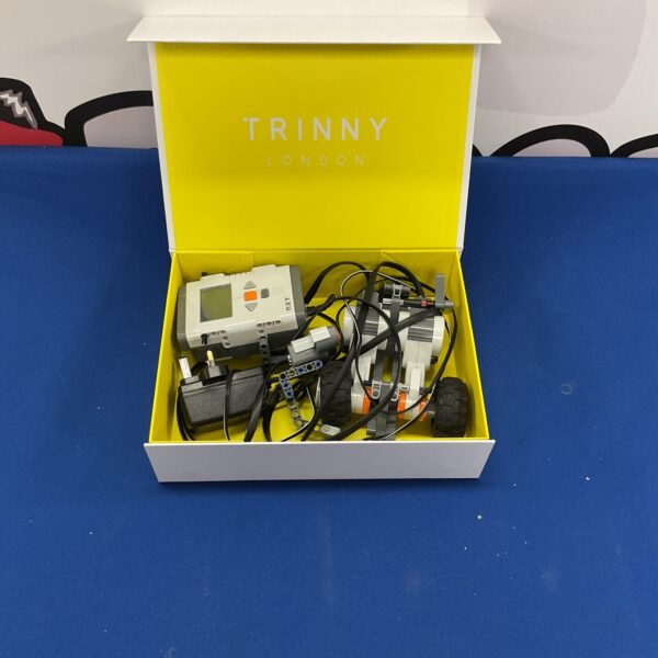 Lego Mindstorms parts lot with programmable brick and cables.