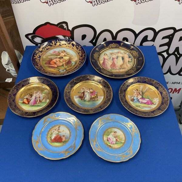 Group of antique Victorian Carlsbad plates with hand-painted scenes.