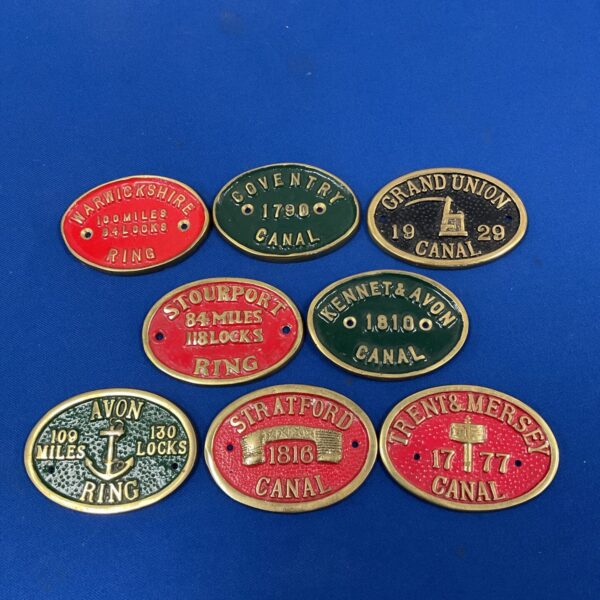 Set of vintage brass canal barge plaques, including Grand Union and Kennet & Avon.