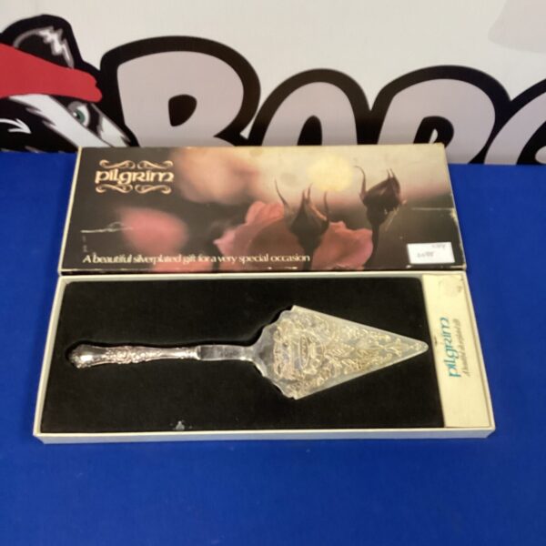 Vintage Pilgrim silverplate cake slice for serving desserts.