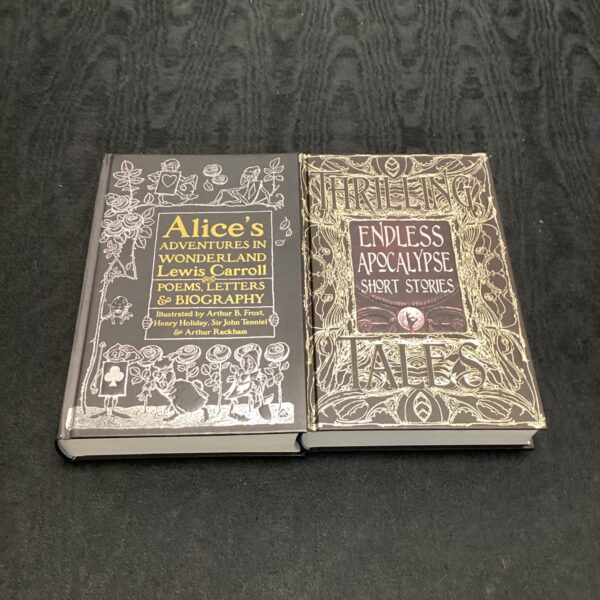 First edition books of Alice's Adventures in Wonderland and Endless Apocalypse.