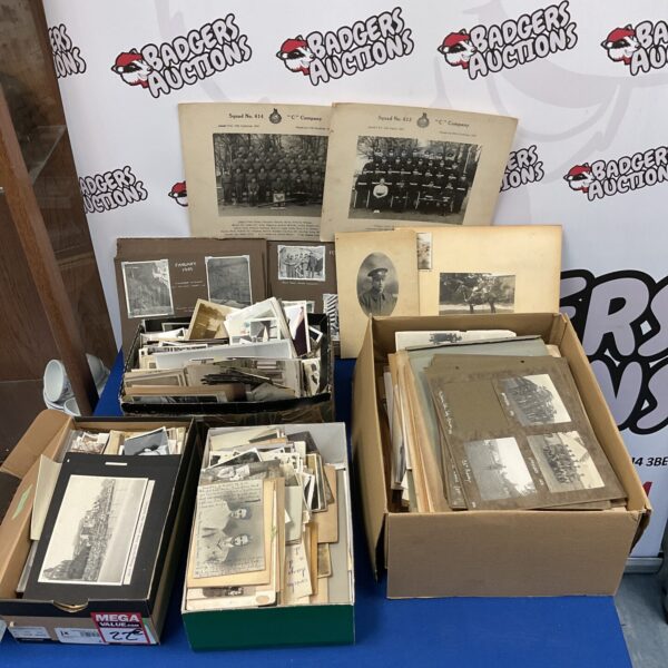 Overview of a large vintage photograph collection with military images.