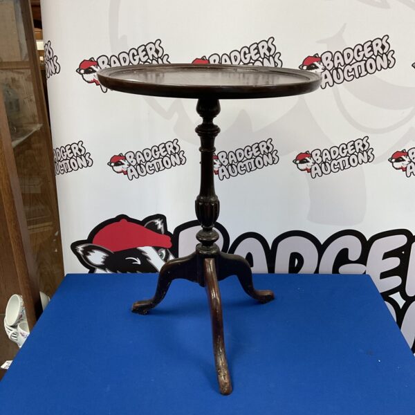 Vintage mahogany wine table with curved legs.