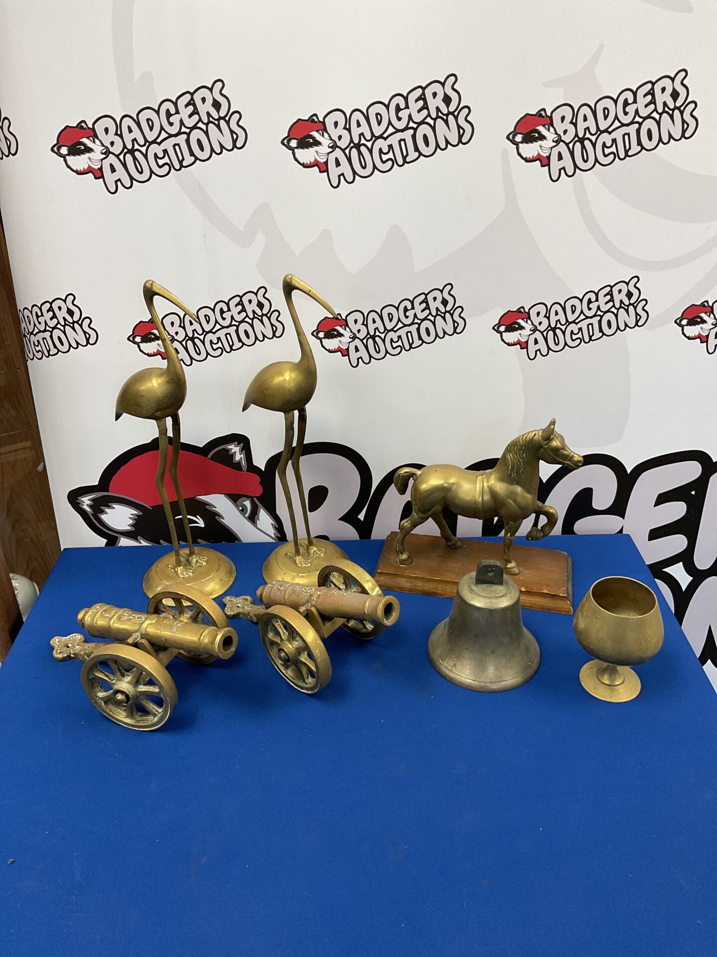 063 Box of brassware including canons & bell