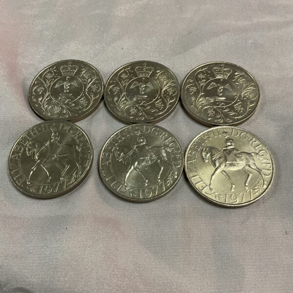 Six Queen Elizabeth II Silver Jubilee Crowns from 1977, collectible British coins.