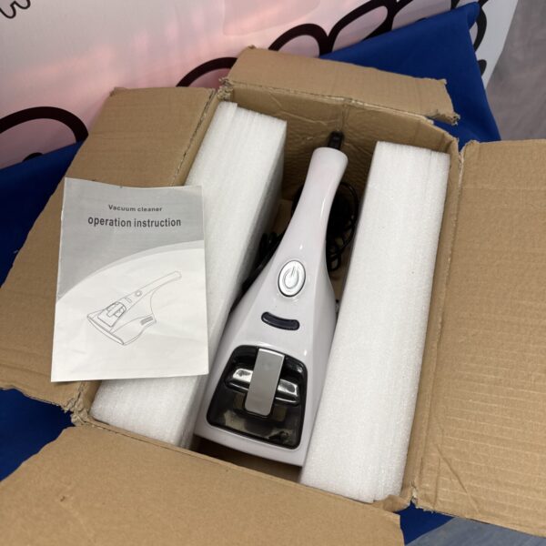 Handheld UV vacuum cleaner for bed and upholstery cleaning.