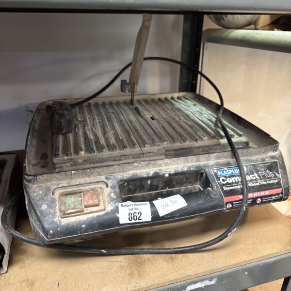 Vintage Plasplugs electric tile cutter for precise tile cutting.