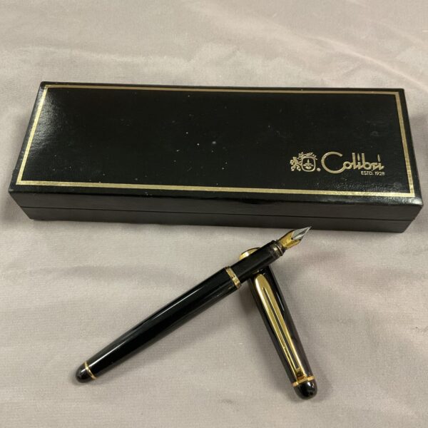 Vintage Colibri fountain pen with gold accents, collectible writing instrument.