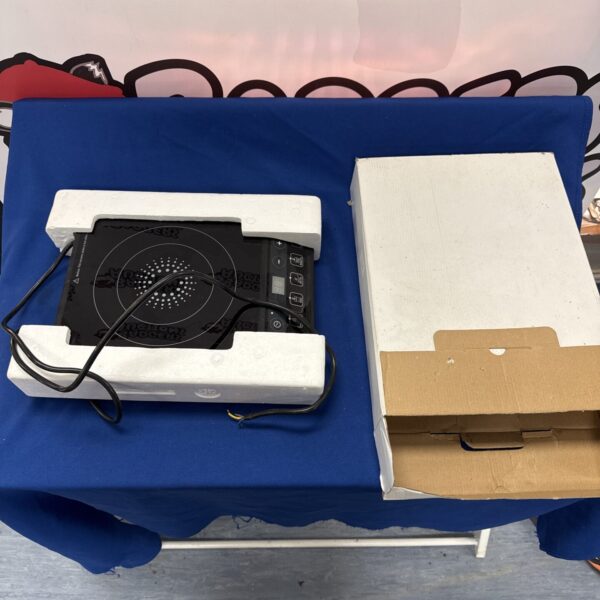 Black single induction hob for countertop cooking.