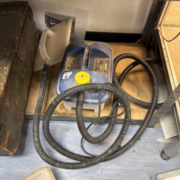 Earlex SS125 wallpaper steamer with hose, for home DIY projects.