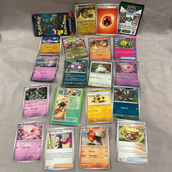 Diverse Pokemon card lot with various designs and species.