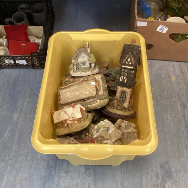 Collection of Lilliput Lane style miniature houses in a box.