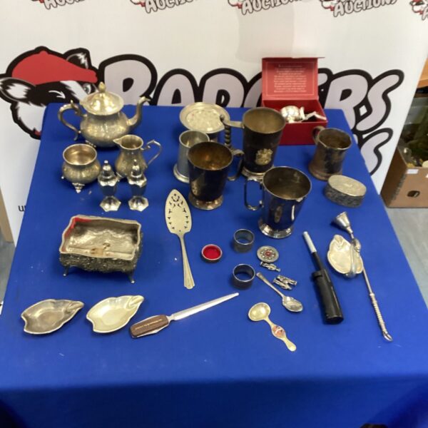 Vintage mixed metalware lot with silver and brass items.