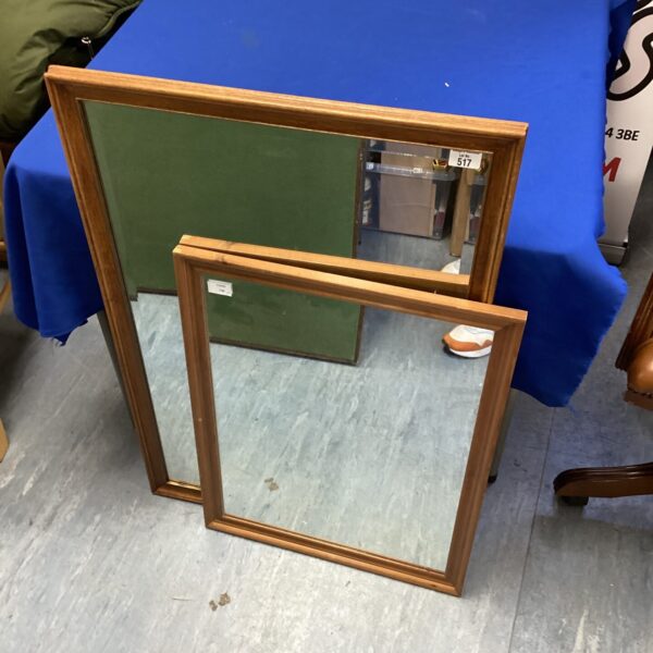 Pair of vintage wooden framed mirrors for wall decoration.