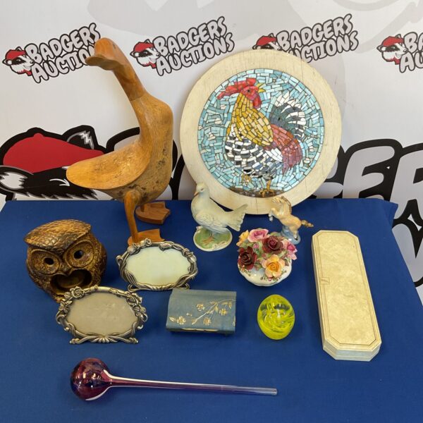 Mixed collectibles lot featuring a wooden duck and glass paperweight.