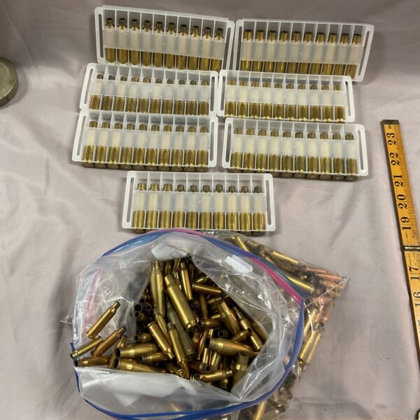 Large lot of spent brass bullet casings for reloading or collecting.