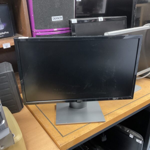 Black Dell 24 inch HD computer monitor on a desk.