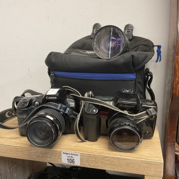 Canon EOS d30 and EOS 10 cameras with lenses and bag.