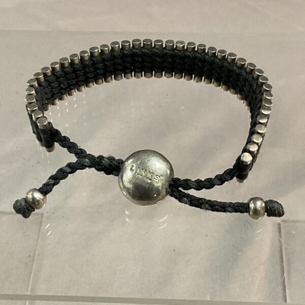 Silver Links of London bracelet with black cord and silver beads.